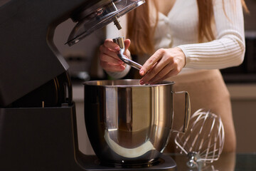 Whipping Ingredients with a Stand Mixer in a Contemporary, Modern Kitchen Environment