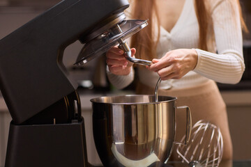 Whipping Ingredients with a Stand Mixer in a Contemporary, Modern Kitchen Environment