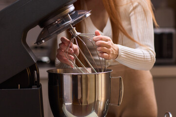 Whipping Ingredients with a Stand Mixer in a Contemporary, Modern Kitchen Environment