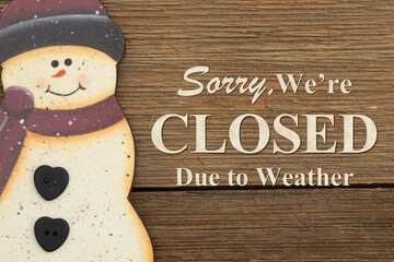 Closed due to weather with a snowman