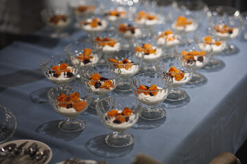 There is a table adorned with an abundance of delicious desserts on it