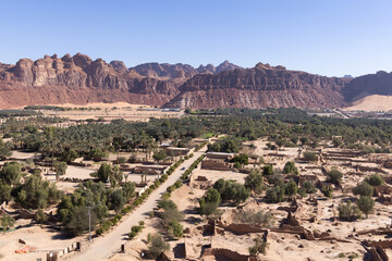 Elevated view over AlUla valley with old town and modern road, Saudi Arabia