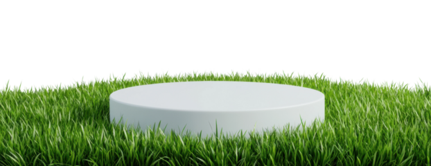 White circular podium on lush green grass with black background, cut out