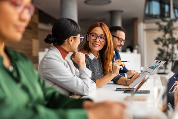 Team Collaborating on Business Strategy in Modern Office Environment