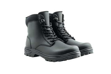 A pair of black leather work boots with laces and metal eyelets on a black background studio shot