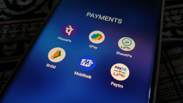 New Delhi, India - March 27 2025: Popular digital payment apps in India - Paytm, PhonePe, and Google Pay, Paytm, Bharatpe, Bhim UPI and MobiKwik - are seen on smartphone screen.