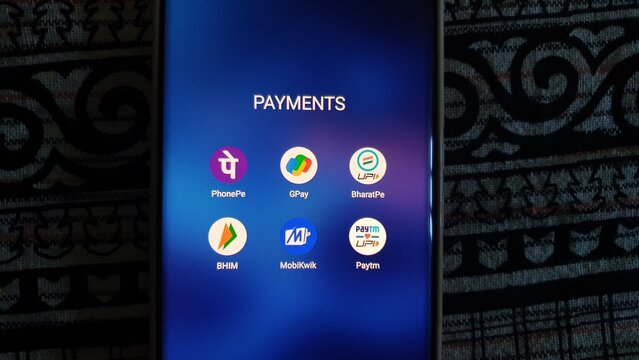 New Delhi, India - March 27 2025: Popular digital payment apps in India - Paytm, PhonePe, and Google Pay, Paytm, Bharatpe, Bhim UPI and MobiKwik - are seen on smartphone screen.