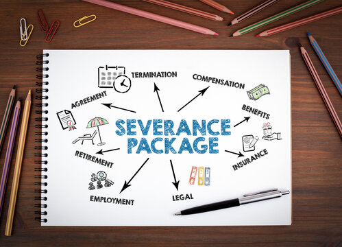 SEVERANCE PACKAGE Concept. Notebooks, pen and colored pencils on a wooden table