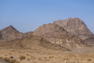 Panorama of mountain ranges rising one after another. Shot in Yazd Province, Iran.