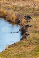 The river bank collapsed as a result of erosion and being washed away by flowing water. High angle view