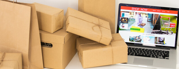 laptop computer with postal parcel, Selling online ideas concept