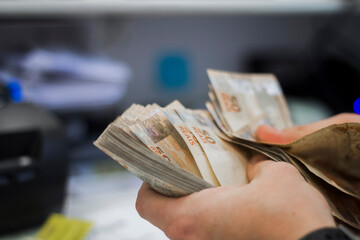 Businessman counting and exchanging money - Brazilian Real - Reais.