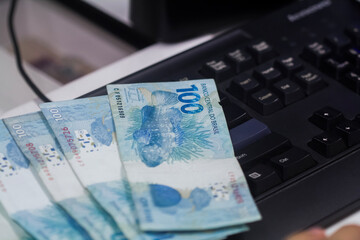 Businessman counting and exchanging money - Brazilian Real - Reais.