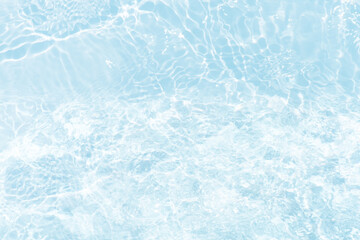 Blue water with ripples on the surface. Defocus blurred transparent blue colored clear calm water surface texture with splashes and bubbles. Water waves with shining pattern texture background.