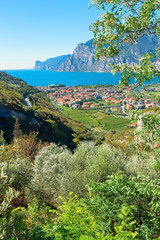view from lookout point to lake Gardasee and tourist resort Torbole, italy