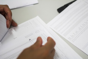 Crop shot of a business person with pen signing document