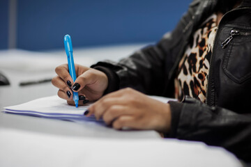 Crop shot of a business person with pen signing document