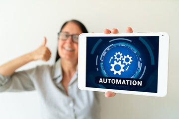 Happy woman doing automation process at work. Concept of implementing AI to do repetitive tasks.