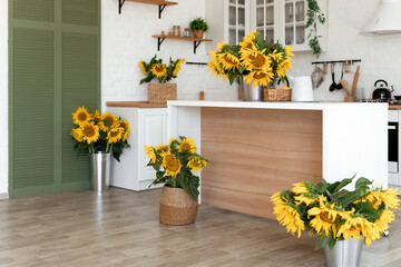 Modern Kitchen Interior with Island, Sink, Cabinets, and Sunflowers in New Luxury Home.