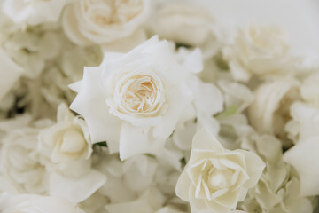 Wedding decoration in a restaurant. White flowers, serving and decor for a wedding