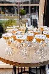 Many orange cocktails on the table. Top view. Alcoholic party and celebration in the restaurant