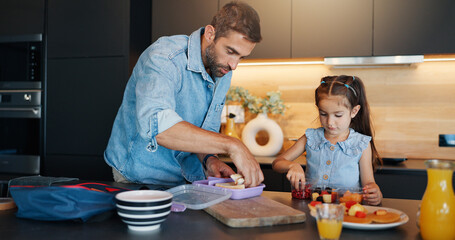 Dad, girl and packing lunch box in kitchen with sandwich, fruit and ready for back to school. Food,...