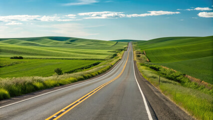 A smooth two-lane highway winding through rolling green fields under a clear blue sky, creating a tranquil, scenic drive with a limitless sense of exploration.