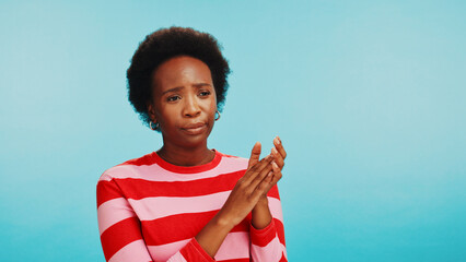 Annoyed, clapping hands and black woman in studio with sarcasm, bored and irritated expression....