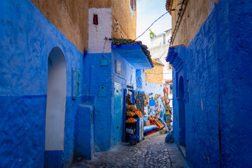 Curtains A cozy blue street with a small grocery store in the center of the Medina of Chefchaouen, the blue city