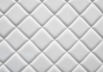 Fototapeta premium White leather upholstery with a quilted diamond pattern and seamless texture