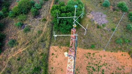 aerial view of tower mast antennas station in the African bush, telecommunication antenna mast or...