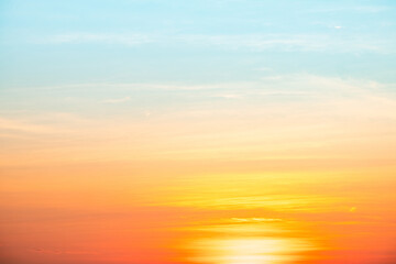 Sky,sunset, beautiful , luxury soft gradient orange gold clouds and sunlight on the blue sky perfect for the background, Sunrise on morning or evening in winter warm time ,Twilight summer,silhouette