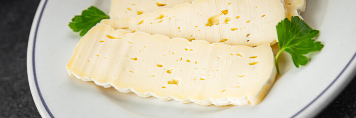 Cheese slices tartiflette soft cheese tasty fresh delicious gourmet food background on the table...