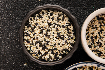 Sesame spice mix white and black tasty fresh gourmet food background on table rustic food top view copy space keto and paleo diet vegetarian and vegan food
