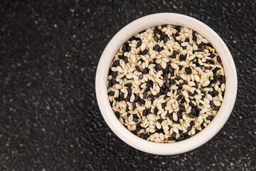 Sesame spice mix white and black tasty fresh gourmet food background on table rustic food top view copy space keto and paleo diet vegetarian and vegan food