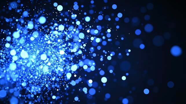 A mesmerizing cosmic dust cloud explodes with vibrant blue energy, shimmering with countless tiny lights against a deep black backdrop.