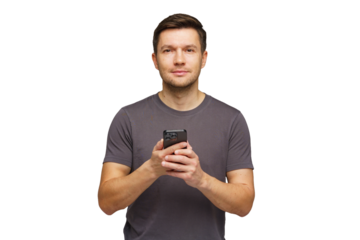 Man holding smartphone and looking directly at the camera in a neutral background setting