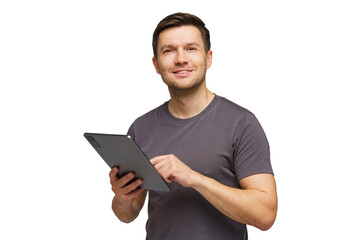 Man smiles while using tablet in indoor setting, showcasing technology and engagement in daily...