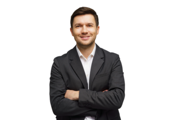Professional man in a suit smiling confidently against a white background during a business portrait session