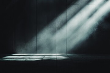 Dramatic light rays in dark room with atmospheric shadows