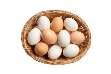 An overhead view of a wicker basket overflowing with fresh, organic eggs, with a white background.