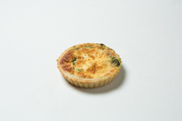 Cheese and Spinach Tartlet on a White Background