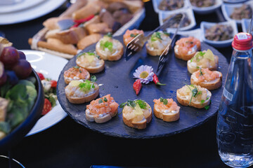 An appealing plate of delicious food arranged creatively on a table that resembles the design of a clock, capturing attention beautifully