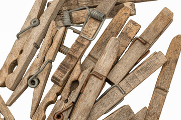 Old wooden clothespins, laundry hooks, on white background