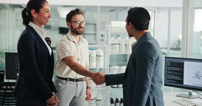 Shaking hands, business people and happy for meeting at office for deal at pharmaceutical company. Woman, men and handshake with welcome, introduction and smile with partnership for production