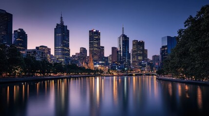 Fototapeta premium City skyline at dusk viewed from across the river