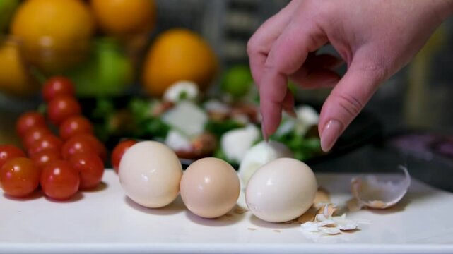 Female hand takes a raw egg. High quality FullHD footage