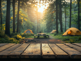 A tranquil camping scene in the woods with a vibrant orange tent set up beside a rustic wooden pathway. The golden sunset casts a warm glow over the peaceful landscape, inviting an adventure in nature