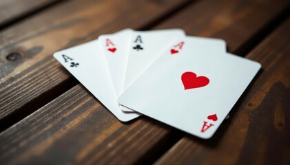 Obraz premium Four aces arranged in a square pattern on a wood table , ??, cards, square