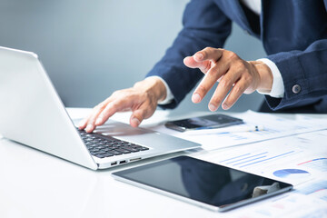 Professional man using computer laptop at modern workspace.Entrepreneur working proactive.Data...